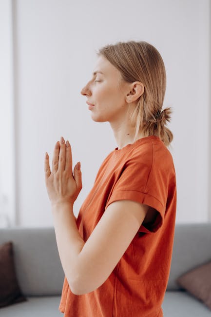 Woman in a beautiful yoga pose with a calm velvet cranberry background